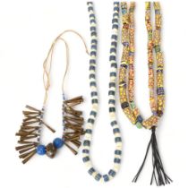 Three strings of African tribal beads, glass millefiore, blue and white Ugandan beads and North