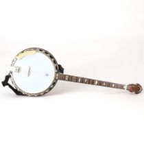 **WITHDRAWN**A Clifford Essex & Son, Regal 401 four string banjo, with inlaid resonator, mother of