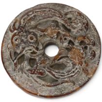 A Chinese jade bi-disc with relief carved catfish design, diameter 5.5cm Good condition