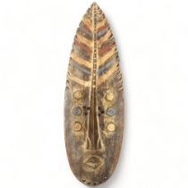 A Grebo, Ivory Coast, wood carved face mask in the form of a leaf, height 52cm