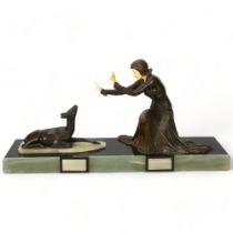 Ugo Cipriani (Menneville, 1887 - 1960), Art Deco spelter and ivorine sculpture, woman and fawn, on