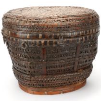 An Indonesian hand-woven fishing basket with metal mounts, height 35cm