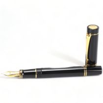 A Parker Duofold Centennial fountain pen, with black lacquer and gilt metal body, 18ct gold (M) nib,