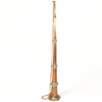 A Tibetan temple horn, telescopic copper sections with brass mounts, extended length 140cm Good