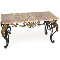 A marble topped coffee table on ornate wrought iron base, height 50cm, top 94 x 45cm Good condition