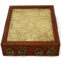 A mahogany-cased rotating road map of Great Britain, by Geographia of London, 4 brass dials moving