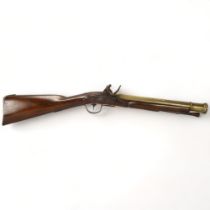 A 19th century flintlock brass-barrelled blunderbuss, with mahogany stock, impressed marks to the