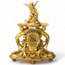 19th century Rococo style gilt-bronze cased mantel clock, with drum case flanked by winged angels