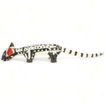 A Bozo, Mali wood carved and painted Hyena, length 62cm Holes to feet from original mount, tail