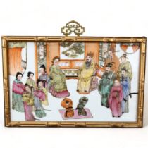 A Chinese white glaze porcelain plaque, with painted and gilded court figures, gilded simulated