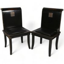 A pair of 20th century Chinese hardwood black lacquer chairs, insert brass plates in back with