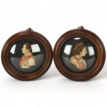 A pair of coloured wax portraits of George III and Queen Charlotte, in mahogany frame with convex