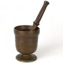 A heavy bronze antique pestle and mortar, pestle length 23cm, mortar height 12cm Good condition