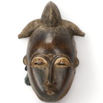 A Baule, Ivory Coast, wood carved portrait mask, height 31cm