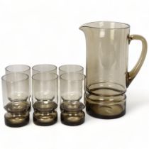 A set of mid 20th century smoked glassware, water jug and six tumblers, polished pontil to base of