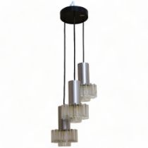 A 1970s' three branch pendant ceiling light fitting, with acrylic star shades and aluminium