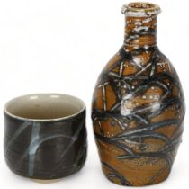 JOSEPH LYNCH, British, a stoneware bottle vase and teabowl, both soda glazed and signed to base,