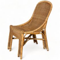 A 1950s' French wicker chair in the manner of Louis Sognot, height 86cm