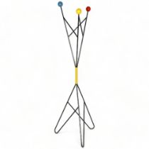 ROGER FERAUD, France, a mid-century coat stand in wrought iron with coloured wooden ball