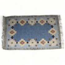 A vintage double sided flat weave (Rollakan) rug, central mottled blue panel with repeated geometric