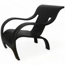 A single sheet bent plywood chair, in the manner of Gerald Summers, black painted, applied label