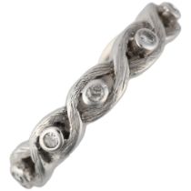 An 18ct white gold diamond full eternity ring, rub-over set with single-cut diamonds and woven band,