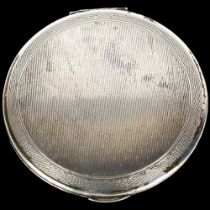 An Elizabeth II silver compact, allover engine turned decoration, by Kigu Ltd, hallmarks London