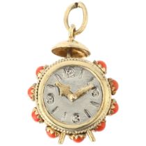 A 9ct gold novelty coral alarm clock charm, charm height excluding bale 26.9mm, 4.6g No damage or
