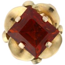 A late 20th century hessonite garnet dress ring, unmarked gold set with 9ct rectangular step-cut