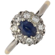 An 18ct gold sapphire and diamond oval cluster ring, claw set with oval mixed-cut sapphire and