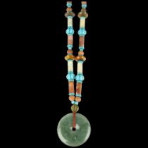 A large Chinese jade and serpentine bi disc necklace, diameter 55.2mm, necklace 70cm, 170g A few