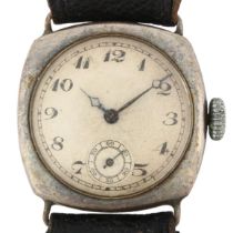 An early 20th century silver cushion-cased mechanical wristwatch, circa 1930s, engine turned