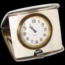 An Art Deco George V silver 8-day travelling clock, Synyer & Beddoes, white enamel dial with