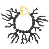 YVES SAINT LAURENT - a Vintage black enamel and rhinestone 'Coral' bracelet, designed by Robert