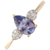 A 9ct gold tanzanite and cubic zirconia dress ring, claw set with pear-cut tanzanite, setting height