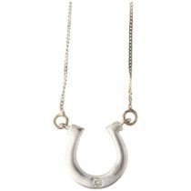 A modern 9ct white gold diamond horse shoe pendant necklace, set with 0.025ct modern round