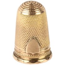 An Antique unmarked gold sewing thimble, with applied shield motif, 23.4mm, 4.6g No damage or