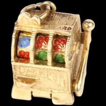 A mid-20th century 9ct gold novelty one-arm bandit slot fruit machine charm/pendant, London 1966,