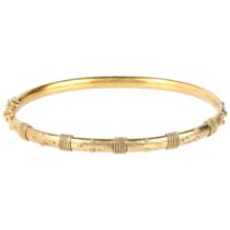 A Victorian 15ct gold Etruscan Revival hinged bangle, circa 1880, with applied rope twist and bead