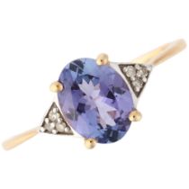 A modern 9ct gold tanzanite and diamond dress ring, claw set with oval mixed-cut tanzanite and