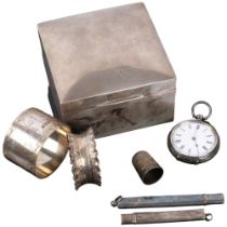 A square silver cigarette box, silver napkin rings, fob watch, etc