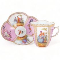 An Antique Dresden quatrefoil cup and saucer, painted pink and white panels decorated with flowers