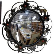 A lovely ornate concave mirror, with metal floral surround, diameter 40cm