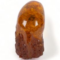 A large faux amber block, with an insect trapped inside, H21cm