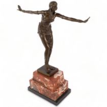 An Art Deco style bronze study of a dancing figure, on marble stand, H48cm