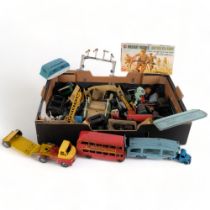 A quantity of various Vintage tinplate and plastic toy vehicles and other accessories, including