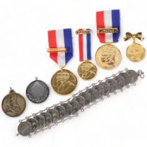 A group of various medals and medallions, including football, Commonwealth commemorative, Coronation