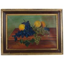 An Antique oil on canvas still life painting, grapes and citrus fruits on a table, unsigned, in a