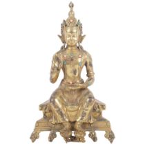 Oriental gilt-bronze Buddha with stone set decoration, on stand, H24cm