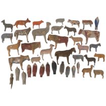 A selection of handmade wooden animals and birds, both farmyard and woodland creatures